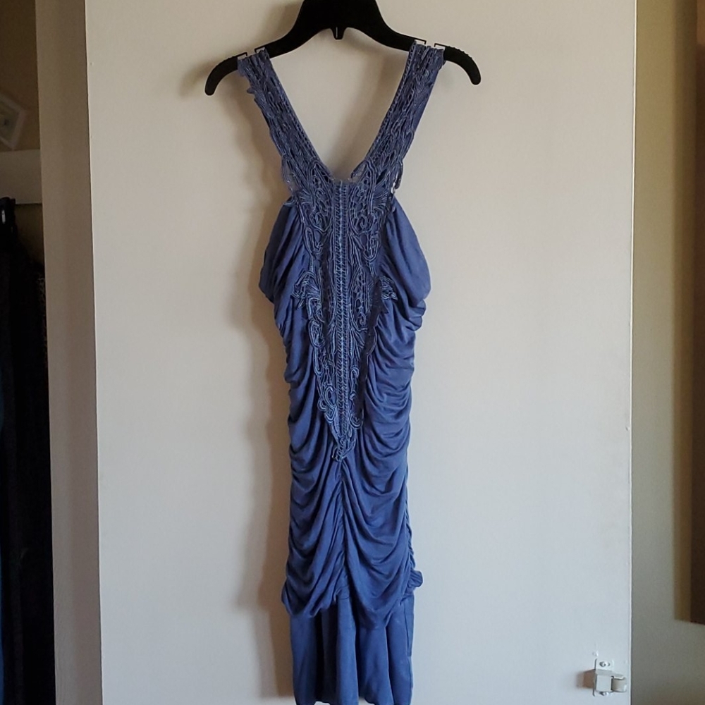 A blue body con dress with design